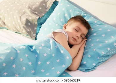 Adorable Boy Sleeping In Bed