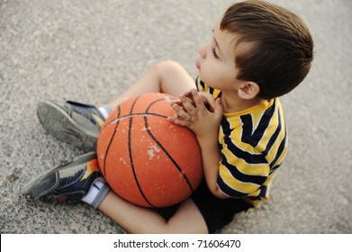 Adorable Child Holding  The Basketball