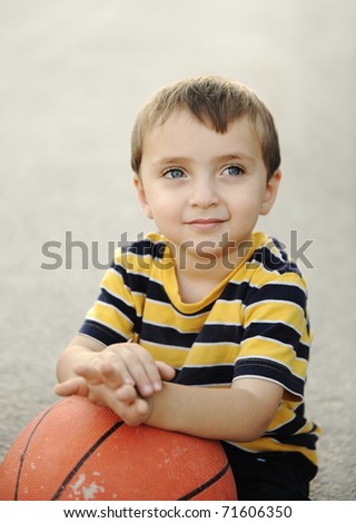 Similar – Cute little boy seated on the wall of a castle