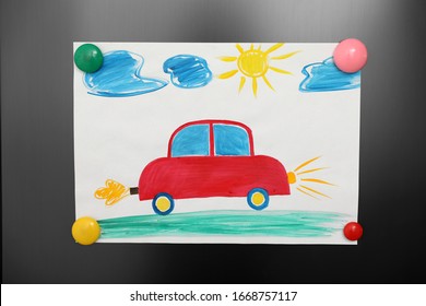 Adorable Child's Drawing With Magnets On Refrigerator  Door, Closeup