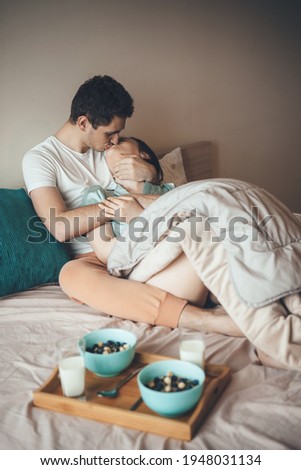 Similar – Little girl playing with boy over the bed