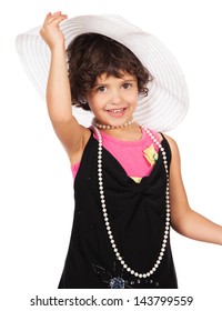 Adorable Cute Caucasian Girl Is Playing Dress Up. She Is Wearing A Black Dress, White Hat, Earrings And Coral High Heel Shoes.