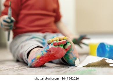 Adorable Cute Caucasian Little Blond Siblings Children Enjoy Having Fun Painting With Brush And Palm At Home Indoors . Cheerful Happy Kids Smiling Drawing Masterpiece Art Picture. Messy Dirty Room