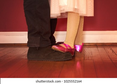 Adorable Daughter Dancing On Father's Feet 