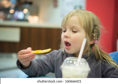 Adorable Girl Have Meal In Fast Food Restaurant