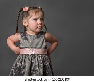 Adorable Grumpy Frustrated Unhappy Toddler Girl With Hands On Hips