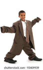 Adorable Handsome Black Boy Child In Baggy Business Suit Laughing And Walking Over White Background.