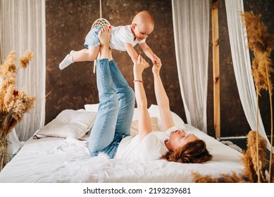 Adorable Infant Baby Girl Daughter Playing Patty Cake With Mom At Home. Happy Family Mother And Cute Little Girl Daughter Funny Game Having Fun Enjoying Sweet Moments Together.