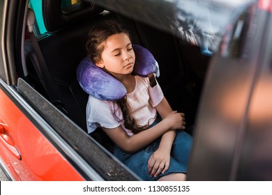 Adorable Kid Sleeping In Car With Neck Pillow