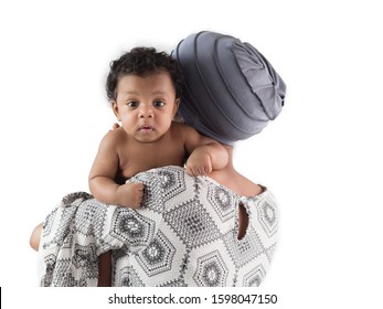 Adorable Little African Baby Boy Looking At Camera While Mom Wearing Headscarf Holding Him On The White Background.