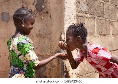 Adorable Little African Girls Drinking Fresh Water From Tap