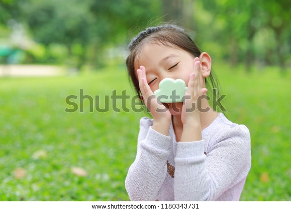 Adorable Little Asian Child Girl Smelling Stock Photo 1180343731