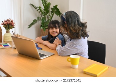 Adorable Little Asian Girl Using Laptop With Grandmother In Living Room. Multi Generational, Family And Love Concept