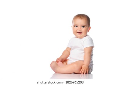 Adorable little baby girl smiling, sitting on the floor, studio shot, isolated on white background, lovely baby portrait