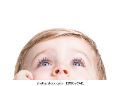 Adorable little boy looking up on a white background