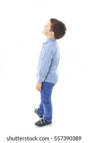 Adorable little boy looking at wall. Isolated on white background 