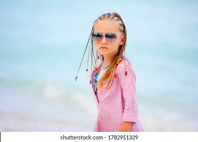 Adorable little girl with Caribbean braids on vacation