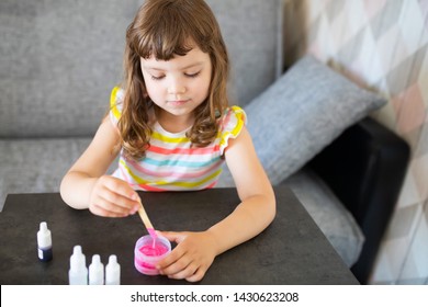 Adorable Little Girl Child Making Slime Closeup Photo