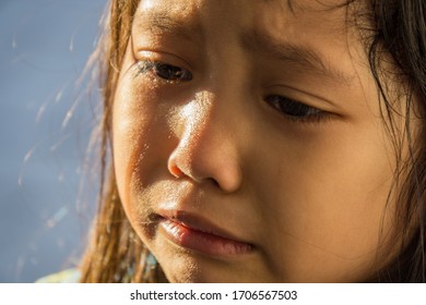 Adorable Little Girl Crying And Feeling Unhappy Stock Photo