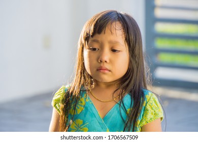 Adorable Little Girl Crying And Feeling Unhappy Stock Photo