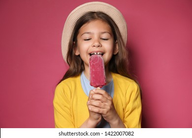 Adorable Little Girl With Delicious Ice Cream Against Color Background