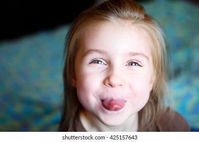 Adorable Little Girl Showing Tongue