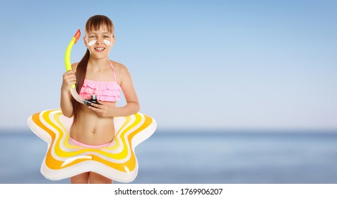Adorable little girl with sun protection cream on face and inflatable ring at beach, space for text. Banner design
