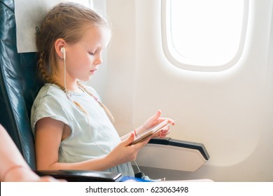 Adorable Little Girl Traveling By Airplane Stock Photo 623063498 ...