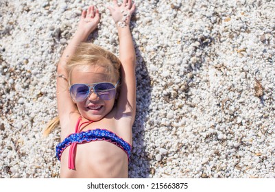 Adorable little girl at tropical beach during summer vacation - Shutterstock ID 215663875