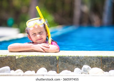 Adorable Little Girls At Mask And Goggles In Outdoor Swimming Po