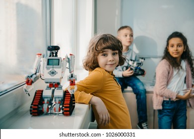 Adorable Little Schoolboy With Diy Robot On Stem Education Class