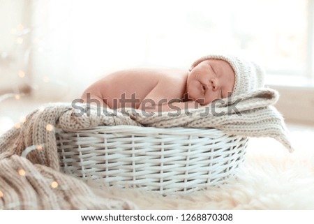 Baby lying in a wicker basket