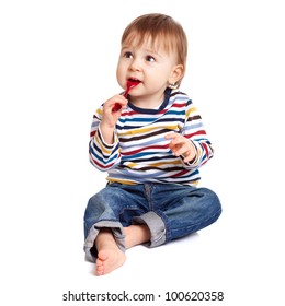 Adorable One Year Old Child Biting Spoon And Smiling, Isolated On White.