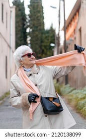 An Adorable Portrait Of An Older Lady Laughing.