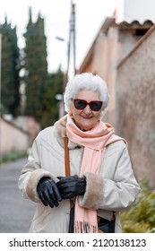 An Adorable Portrait Of An Older Lady Laughing.