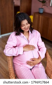 Adorable Pregnant Woman In Domestic Wear Dream To Give Birth, Think And Ponders What Her Future Baby Will Be Like. Tranquil Relaxation. Mom To Be.