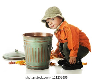 An Adorable Preschooler Picking Up Colorful Leaves To Put In A Small Trash Can.  On A White Background.