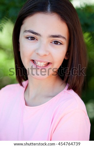 Similar – Adorable preteen girl with plants of background