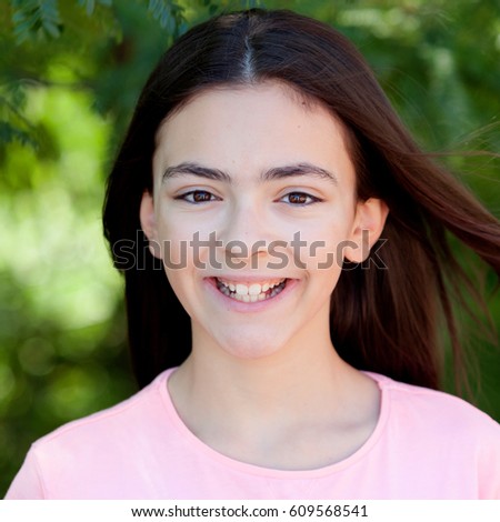 Similar – Adorable preteen girl with plants of background