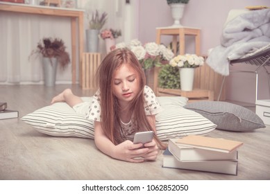 Adorable Pretty Girl Take Selfie Herself In The Living Room, A Child On FaceTime With Friend On Mobile, A Kid Playing Game On Phone