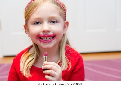 Adorable School Age Girl With Mess Lipstick All Over Face