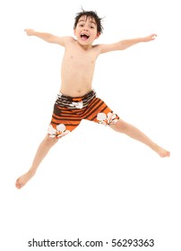 Adorable Seven Year Old French American Boy In Swim Suit And Wet Hair Jumping Excited About Going Swimming.