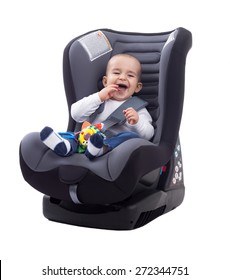 Adorable Smiling Happy Child Sitting In A Car Seat, Isolated