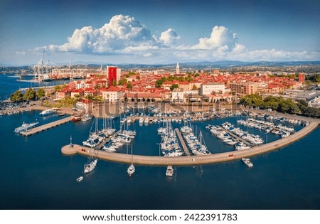 Adorable summer view from flying drone of Koper port. Aerial morning scene of Adriatic coastline, Slovenia, Europe. Colorful Mediterranean seascape. Traveling concept background.