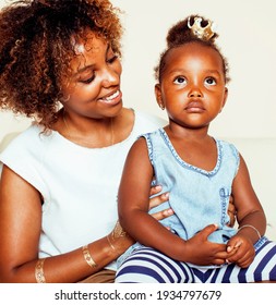 adorable sweet young afro-american mother with cute little daughter, hanging at home, having fun playing smiling, lifestyle people concept, queen girl