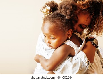 adorable sweet young afro-american mother with cute little daugh