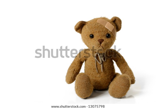 teddy bear with bandage on head