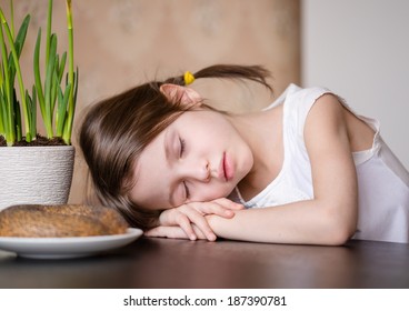 Adorable Tired Preschooler Girl Sleeping At The Table