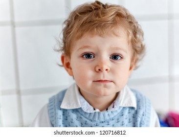 Adorable Toddler With Blue Eyes And Blond Hair Indoor Waiting At Doctor Room