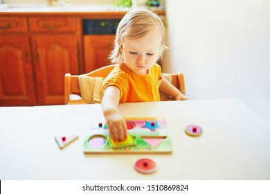 Adorable Toddler Girl Doing Wooden Puzzle Stock Photo 1714036750 ...